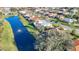 Community aerial highlighting the waterfront homes, mature trees and landscaping at 389 Eden Dr, Englewood, FL 34223