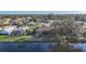 Aerial view showing the home's setting with lush surroundings and waterfront views at 389 Eden Dr, Englewood, FL 34223