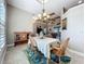 Dining area with natural light, chandelier, and open layout connecting to the living spaces at 389 Eden Dr, Englewood, FL 34223