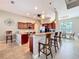 Spacious kitchen featuring dark wood cabinetry, granite countertops, and stainless steel appliances at 389 Eden Dr, Englewood, FL 34223