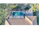 Aerial shot featuring the screened-in pool and the home's tile roof at 389 Eden Dr, Englewood, FL 34223