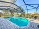 Inviting screened pool with brick patio and serene backyard views, ideal for entertaining at 389 Eden Dr, Englewood, FL 34223