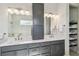 Modern bathroom with double vanity, storage, and a marble shower at 4309 Renwick Dr, Parrish, FL 34219