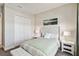 Bright bedroom with a comfortable bed, nightstands, and ample closet space at 4309 Renwick Dr, Parrish, FL 34219