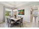 Modern dining room with marble-top table and neutral decor at 4309 Renwick Dr, Parrish, FL 34219