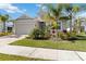 One-story house with light-colored siding, palm trees, and a driveway at 4309 Renwick Dr, Parrish, FL 34219