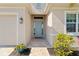 Light teal front door and walkway leading to the entrance at 4309 Renwick Dr, Parrish, FL 34219