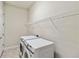 Convenient laundry room with washer, dryer, and overhead shelving at 4309 Renwick Dr, Parrish, FL 34219