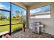 Outdoor kitchen area with a grill and screened enclosure at 4309 Renwick Dr, Parrish, FL 34219