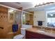 Bathroom featuring tiled shower with glass door, granite countertop, and modern fixtures at 435 Cerromar Ln # 328, Venice, FL 34293