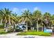 Inviting Venice Beach entrance surrounded by lush greenery and palm trees, with a sign welcoming visitors at 435 Cerromar Ln # 328, Venice, FL 34293