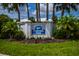 Community sign of Farmington Vistas is surrounded by mature landscaping at 435 Cerromar Ln # 328, Venice, FL 34293