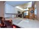 Kitchen featuring stone countertops, stainless appliances, white cabinetry and bar stool seating at 435 Cerromar Ln # 328, Venice, FL 34293