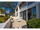 Inviting patio featuring tile flooring, two chairs, and sliding glass doors for seamless indoor-outdoor living at 435 Cerromar Ln # 328, Venice, FL 34293