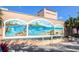 Venice Theatre featuring vibrant murals and a serene water fountain, creating a cultural and visually appealing setting at 435 Cerromar Ln # 328, Venice, FL 34293