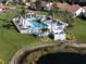 Relax in the community pool surrounded by lush greenery and enjoy the Florida lifestyle at 4951 Summertree Rd, Venice, FL 34293