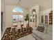 Bright dining room with a lovely chandelier and a display cabinet at 4951 Summertree Rd, Venice, FL 34293