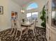 Elegant dining room with a decorative light fixture and a beautiful area rug at 4951 Summertree Rd, Venice, FL 34293