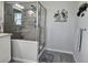 Bathroom with a stand up shower, vanity, and decorative artwork at 530 Walnut Cir, Venice, FL 34285