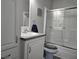 Clean bathroom features a modern sink, toilet, and shower with glass doors at 530 Walnut Cir, Venice, FL 34285