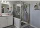 Bathroom with a stand up shower, vanity, and decorative artwork at 530 Walnut Cir, Venice, FL 34285