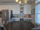 Bright dining area featuring stainless steel appliances and white custom cabinetry at 530 Walnut Cir, Venice, FL 34285