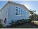 Home exterior with many windows and trimmed green bushes, a great view at 530 Walnut Cir, Venice, FL 34285