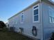 The side of the home features several windows, complementing its exterior at 530 Walnut Cir, Venice, FL 34285