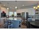 Modern kitchen featuring stainless appliances and an island with barstool seating at 530 Walnut Cir, Venice, FL 34285