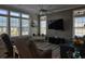 Relaxing living room with comfortable seating, modern decor, stained glass windows, and plenty of natural light at 530 Walnut Cir, Venice, FL 34285