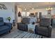 Open living room featuring modern decor next to the eat-in kitchen with stainless steel appliances at 530 Walnut Cir, Venice, FL 34285