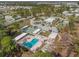 Aerial view of the community showcasing a pool, recreation area, parking, and surrounding lush greenery offering a serene setting at 5311 Palena Blvd, North Port, FL 34287