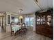 Cozy dining area featuring a wooden table, chairs, and a built-in display cabinet at 5311 Palena Blvd, North Port, FL 34287