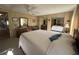 Bright main bedroom featuring a ceiling fan, mirrored closet, and a neutral color palette at 5311 Palena Blvd, North Port, FL 34287