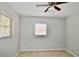 Bright bedroom with neutral walls, tile floor, and windows for ample natural light and ceiling fan at 5527 20Th W St, Bradenton, FL 34207