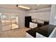 Well-lit kitchen featuring white cabinets, black appliances, and easy access to screened lanai at 5527 20Th W St, Bradenton, FL 34207