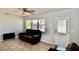 Cozy living room with large window providing natural light, tile flooring, and neutral color scheme at 5527 20Th W St, Bradenton, FL 34207