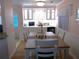 Dining area with built-in bar and white cabinets at 562 Longwood Dr, Venice, FL 34285