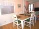 Bright dining area with wood table and chairs at 562 Longwood Dr, Venice, FL 34285