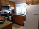 Galley kitchen with granite countertops at 562 Longwood Dr, Venice, FL 34285