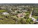 An aerial shot reveals the property and its beautiful wooded surroundings at 5694 Hale Rd, Venice, FL 34293