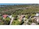 A sunny, high angle shows the home's location among lush greenery with waterway views at 5694 Hale Rd, Venice, FL 34293