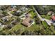 The bird's eye view shows the home's pool and the detached garage at 5694 Hale Rd, Venice, FL 34293