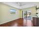 Bedroom featuring a large window, sliding door and view of pool at 5694 Hale Rd, Venice, FL 34293