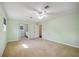 Spacious bedroom with carpet, ceiling fan, and large closet at 5694 Hale Rd, Venice, FL 34293