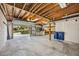 Unfinished garage space with exposed beams and shelving at 5694 Hale Rd, Venice, FL 34293