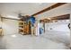 Large garage featuring built-in storage and exposed beams at 5694 Hale Rd, Venice, FL 34293