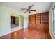 Living room with hardwood floor and large built-in shelves at 5694 Hale Rd, Venice, FL 34293