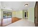 Bright and airy living room featuring hardwood floors and sliding glass doors to the pool area at 5694 Hale Rd, Venice, FL 34293