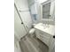 Bathroom featuring a sink with gray and white countertops and a toilet at 590 Portside Dr, North Port, FL 34287